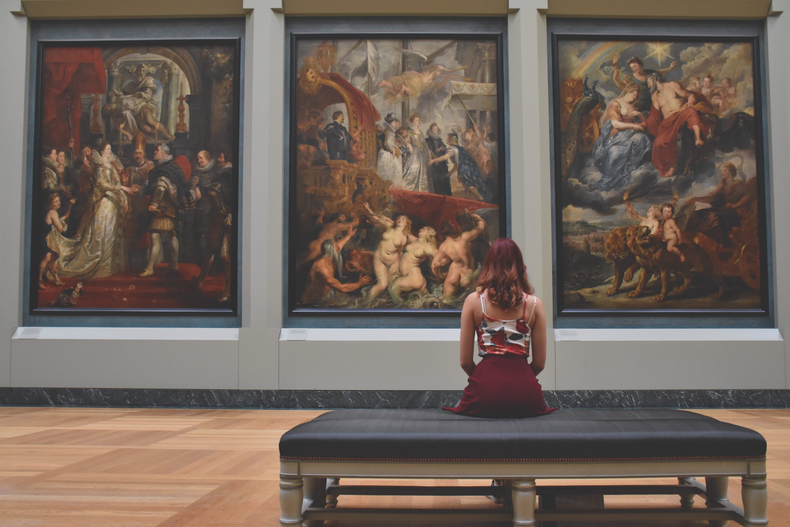 Woman seated in a museum exhibit